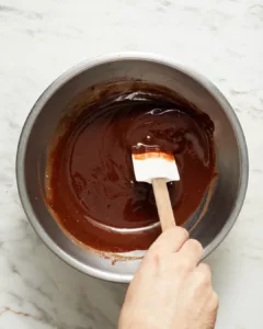 melting chopped semisweet chocolate into hot butter for mini lava cake batter