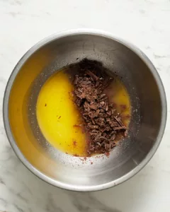 melting chopped semisweet chocolate into hot butter for mini lava cake batter