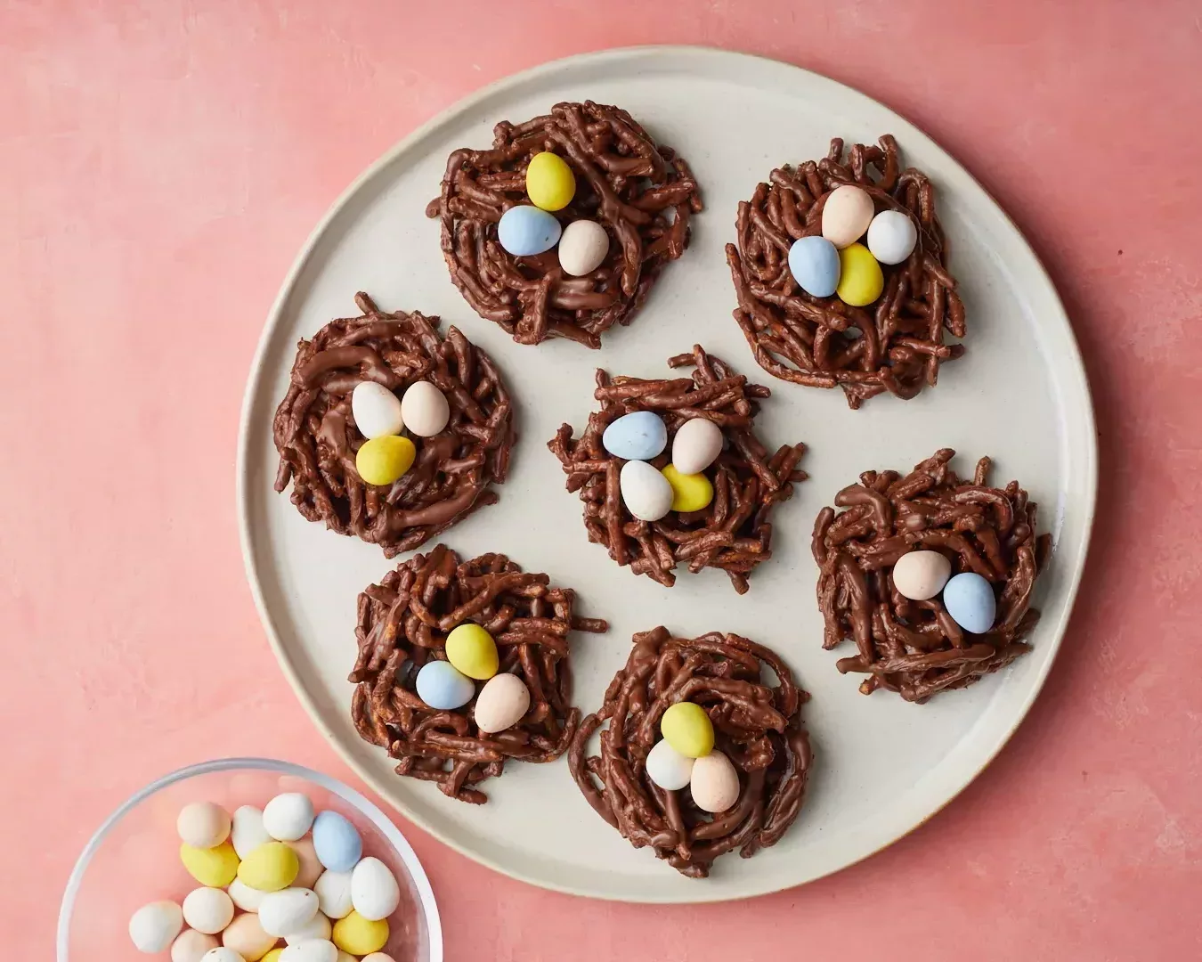 chocolate no-bake easter birds nest cookies with chocolate eggs on white serving plate