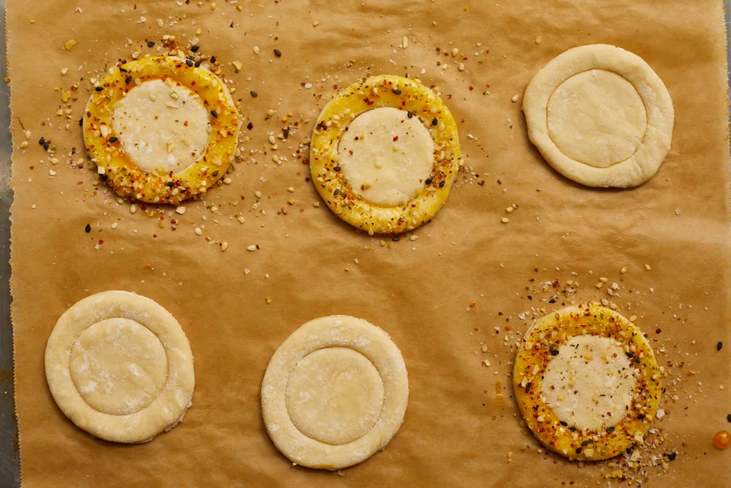 circles of puff pastry brushed with egg wash and topped with everything bagel seasoning