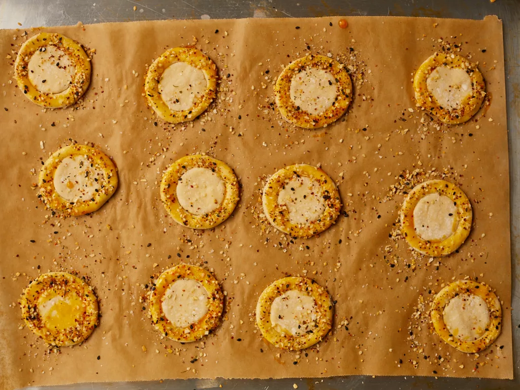 circles of puff pastry brushed with egg wash and topped with everything bagel seasoning