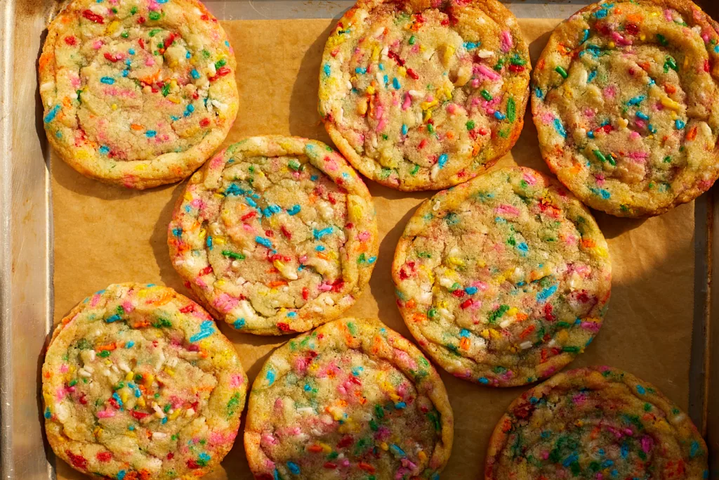 rainbow sprinkle confetti funfetti cookies on a tray