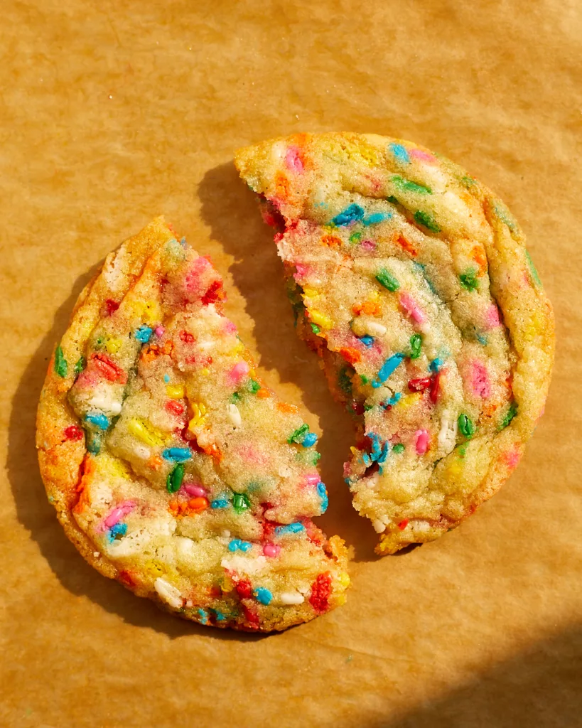 rainbow sprinkle confetti funfetti cookies on a tray