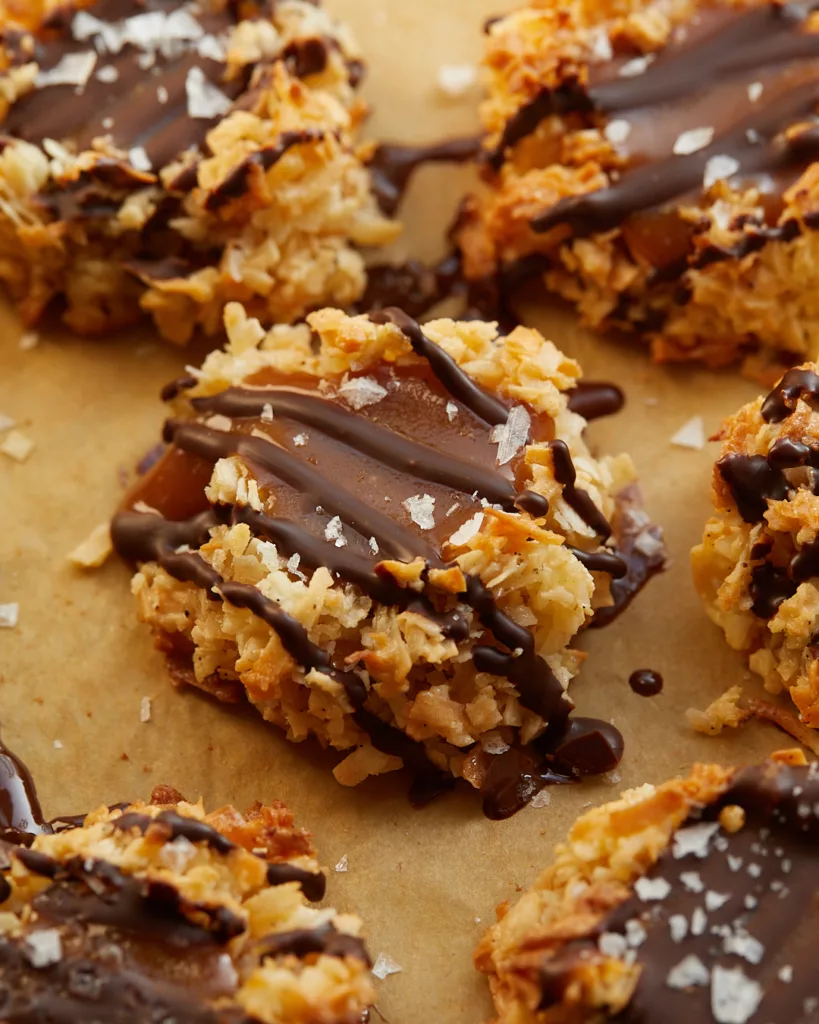 salted caramel filled macaroons with a chocolate drizzle