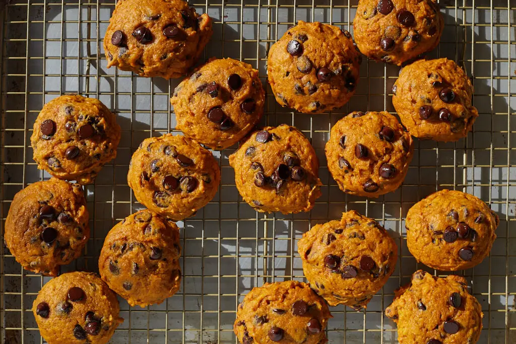 pumpkin chocolate chip cookies on a wire rack