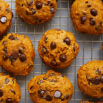 pumpkin chocolate chip cookies on a wire rack