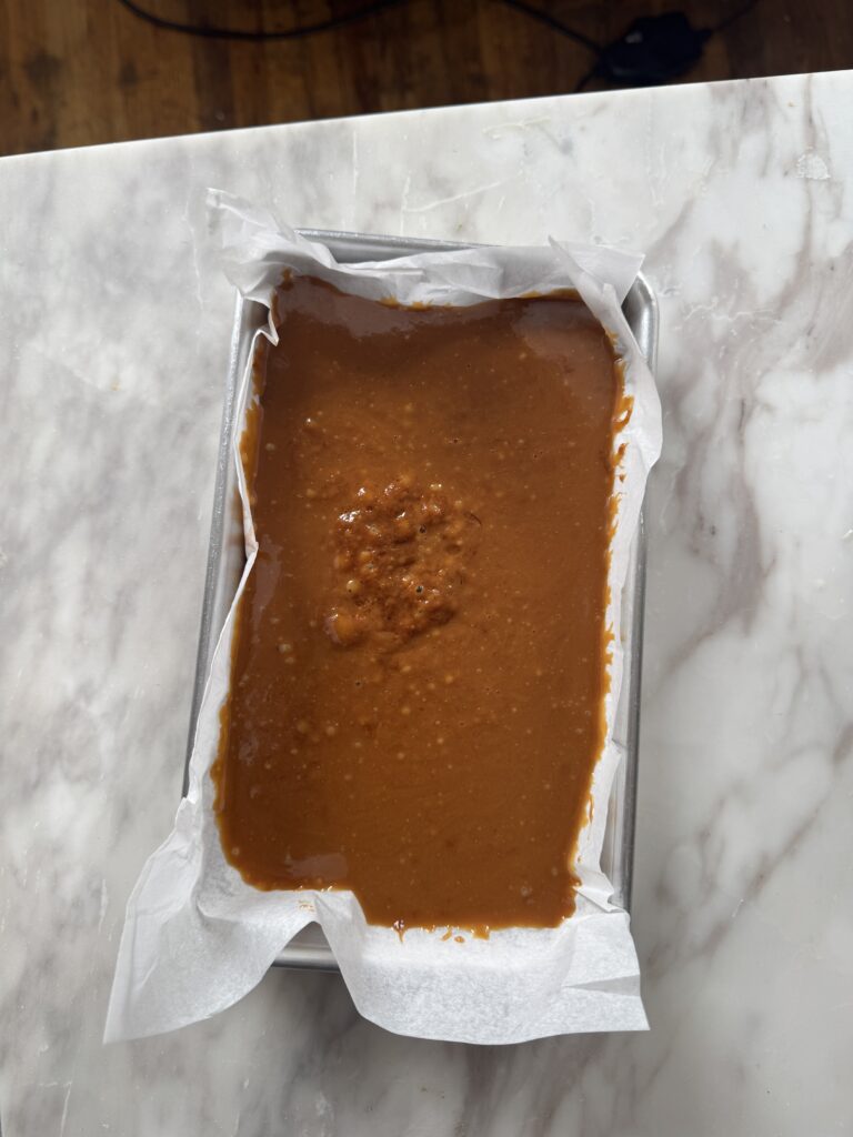 a tray of coconut caramel setting up