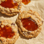 a close up of a coconut caramel chocolate chip cookies